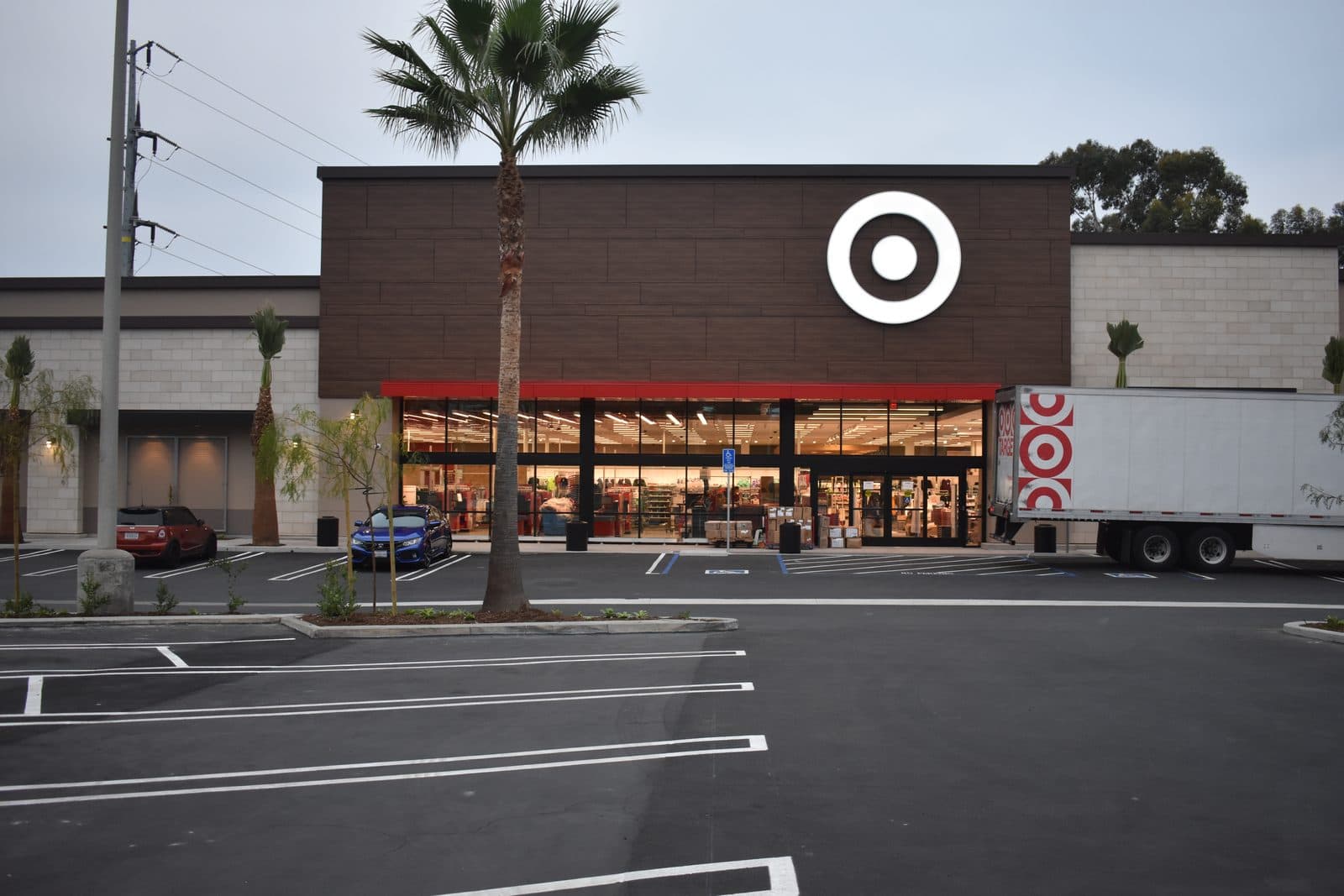 Big-box storefront — fresh stripes over new seal coat